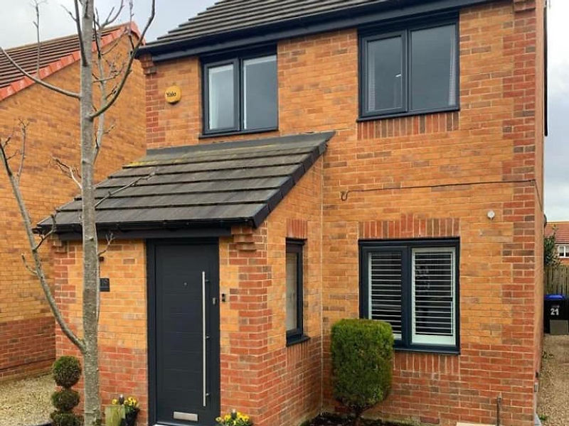 House after dark grey window spray